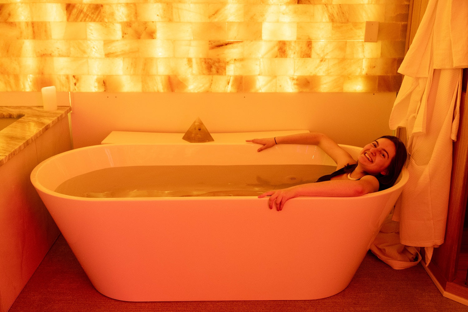 Woman refreshing and relaxing in the cold plunge pool