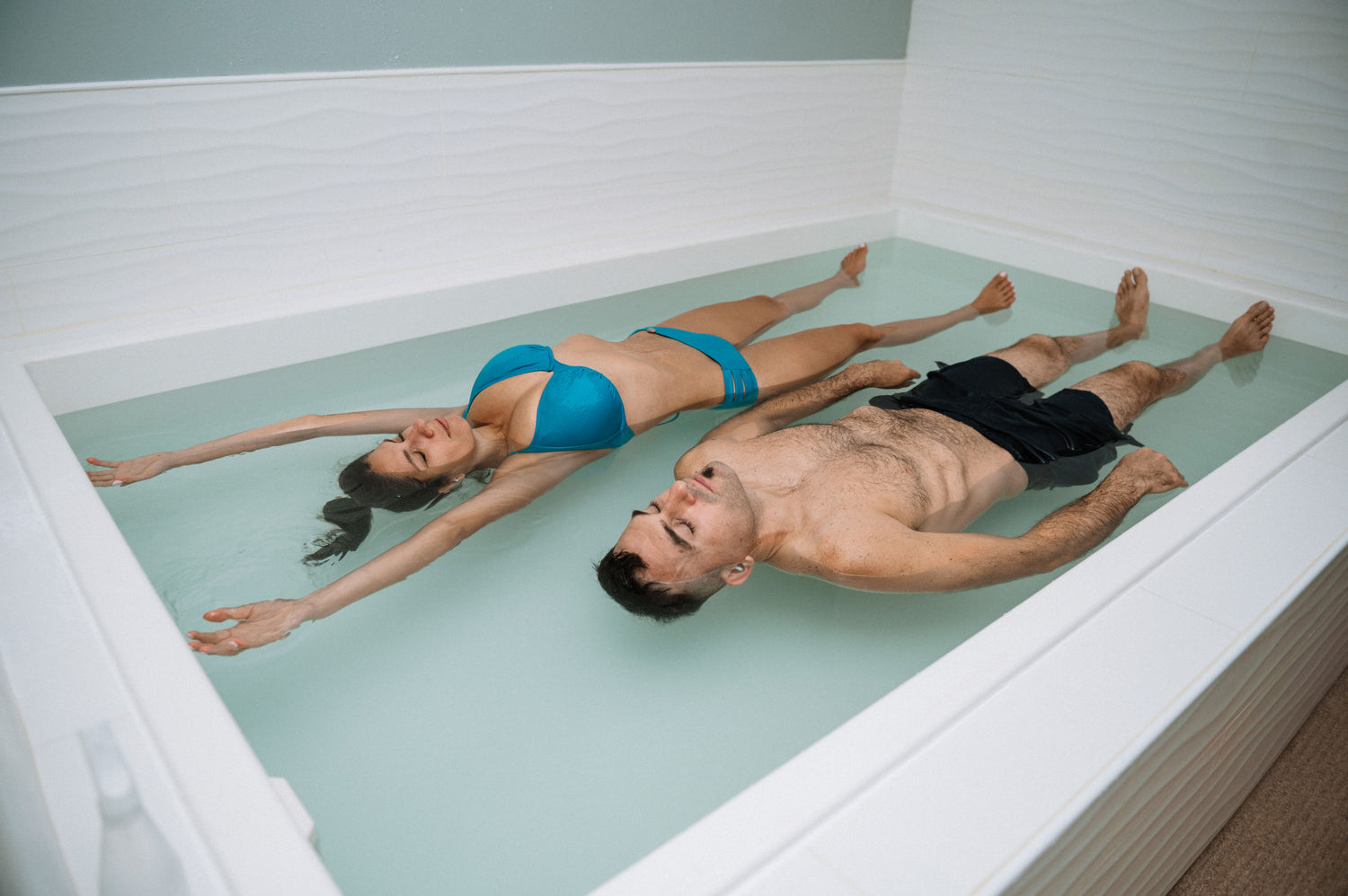 couple relaxing and enjoying the open tank float room together