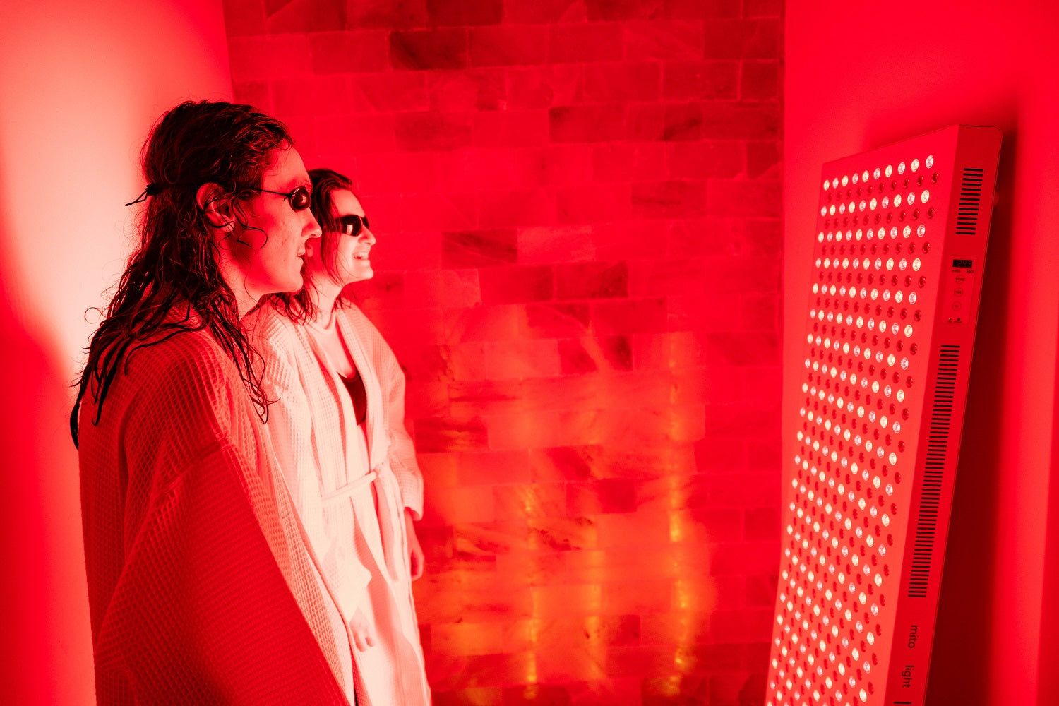 Couple refreshing in the red light therapy room